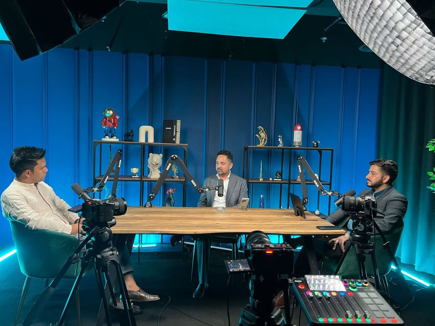 Shishir Yogi leading executive planning session with strategic panel in studio