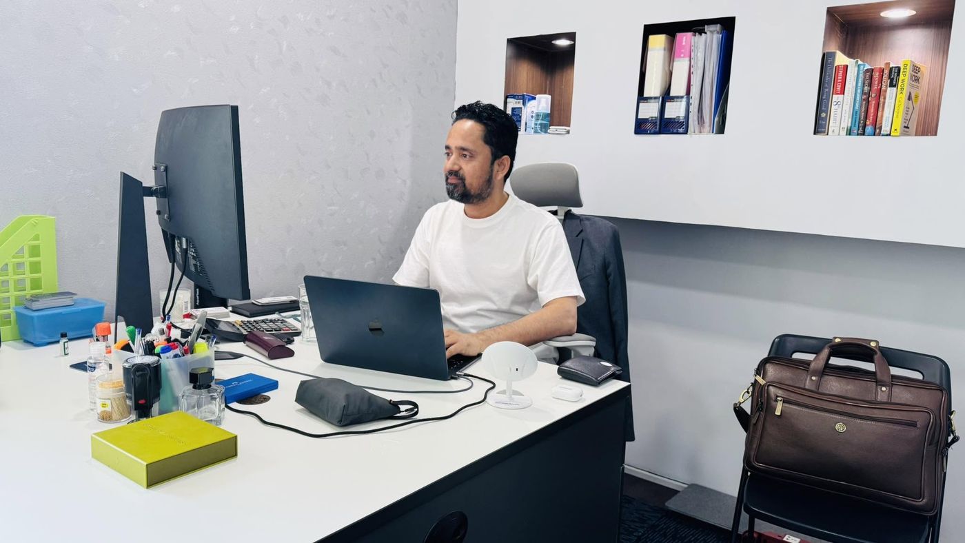 Shishir Yogi at his office desk in Dubai